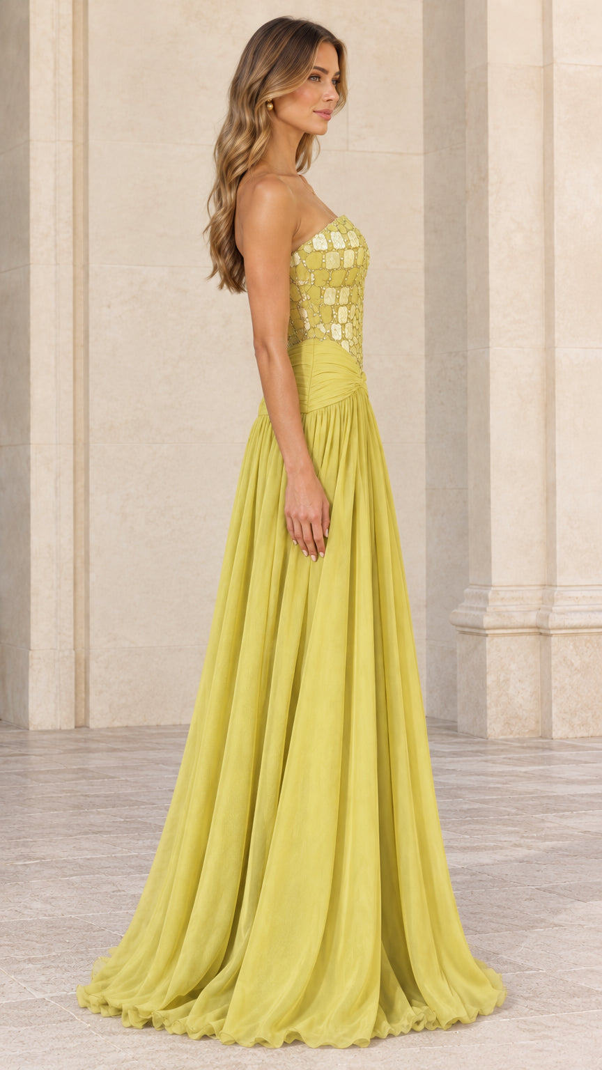 Side profile view of chartreuse strapless chiffon formal dress