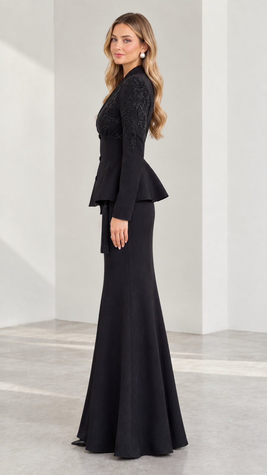 Side profile of black beaded two-piece formal skirt suit