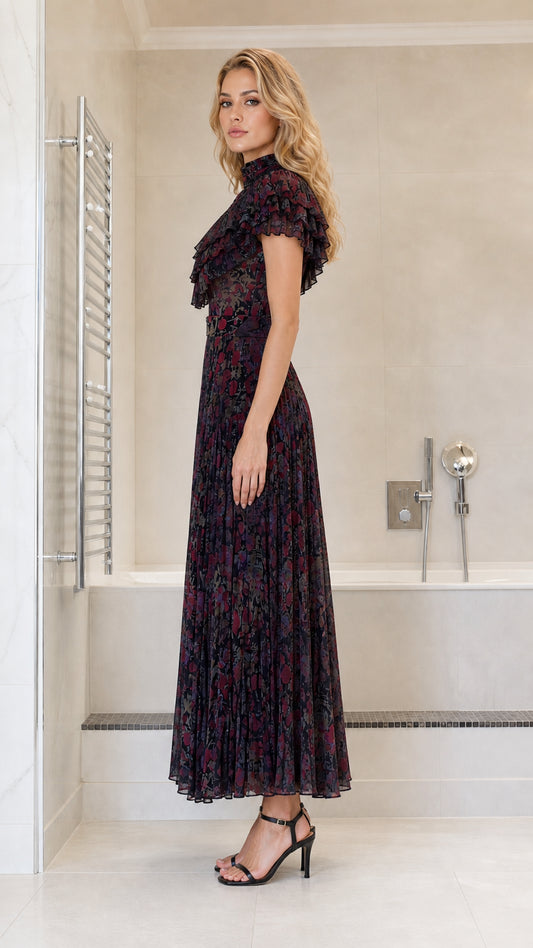 Side profile view of dark multi pleated maxi dress