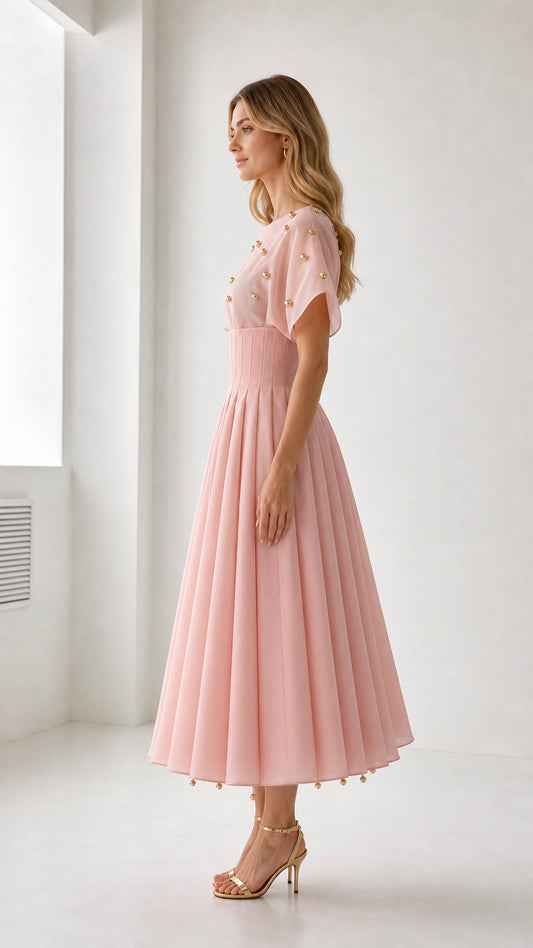 Side view of pink midi dress showing fitted waist silhouette