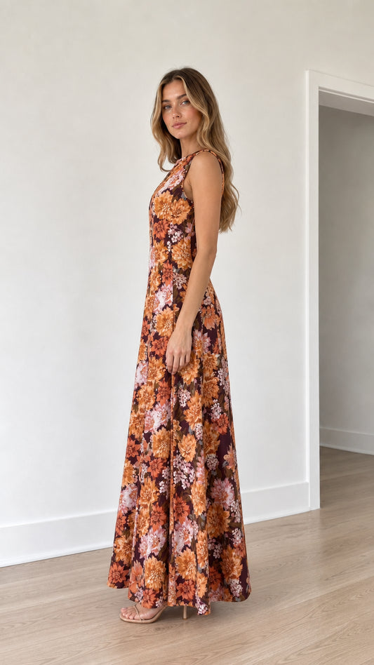 Side view of woman wearing burgundy floral print maxi dress