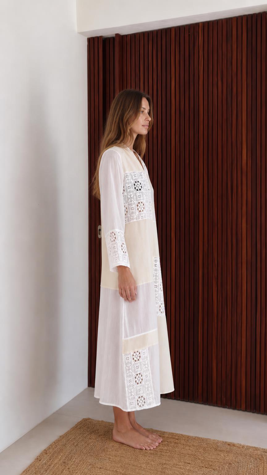 Model wearing white boho patchwork lace long sleeve maxi dress side view