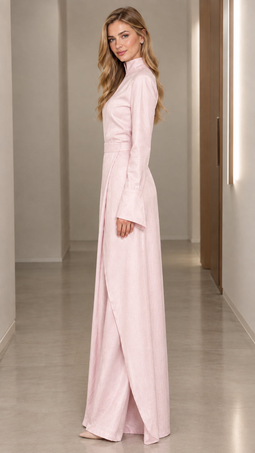 Side profile view of Blush Pink long sleeve wrap maxi dress showcasing structured drape