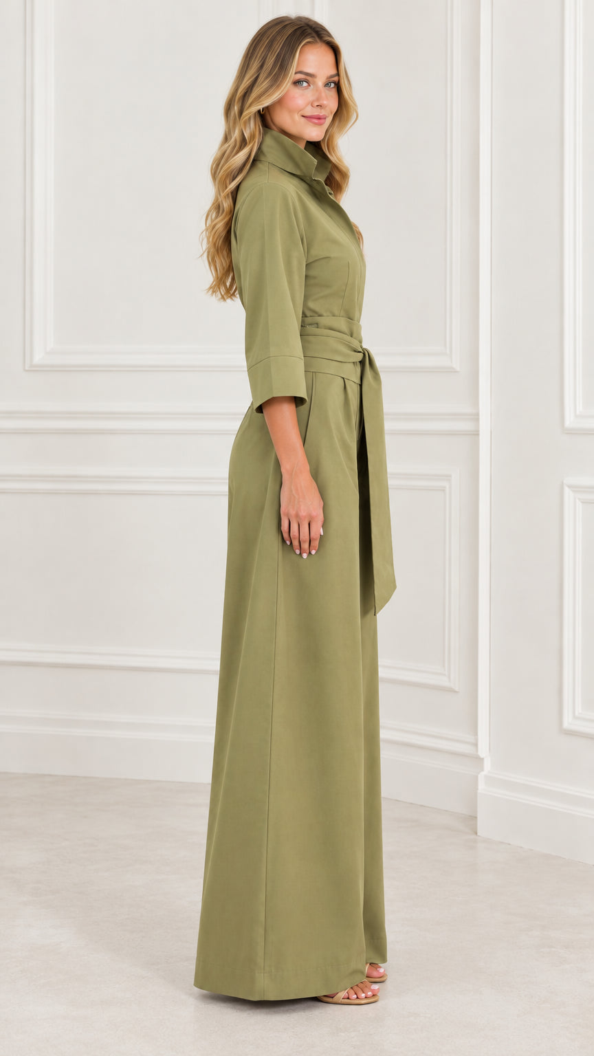 Side view of woman posing in an olive green wide-leg jumpsuit