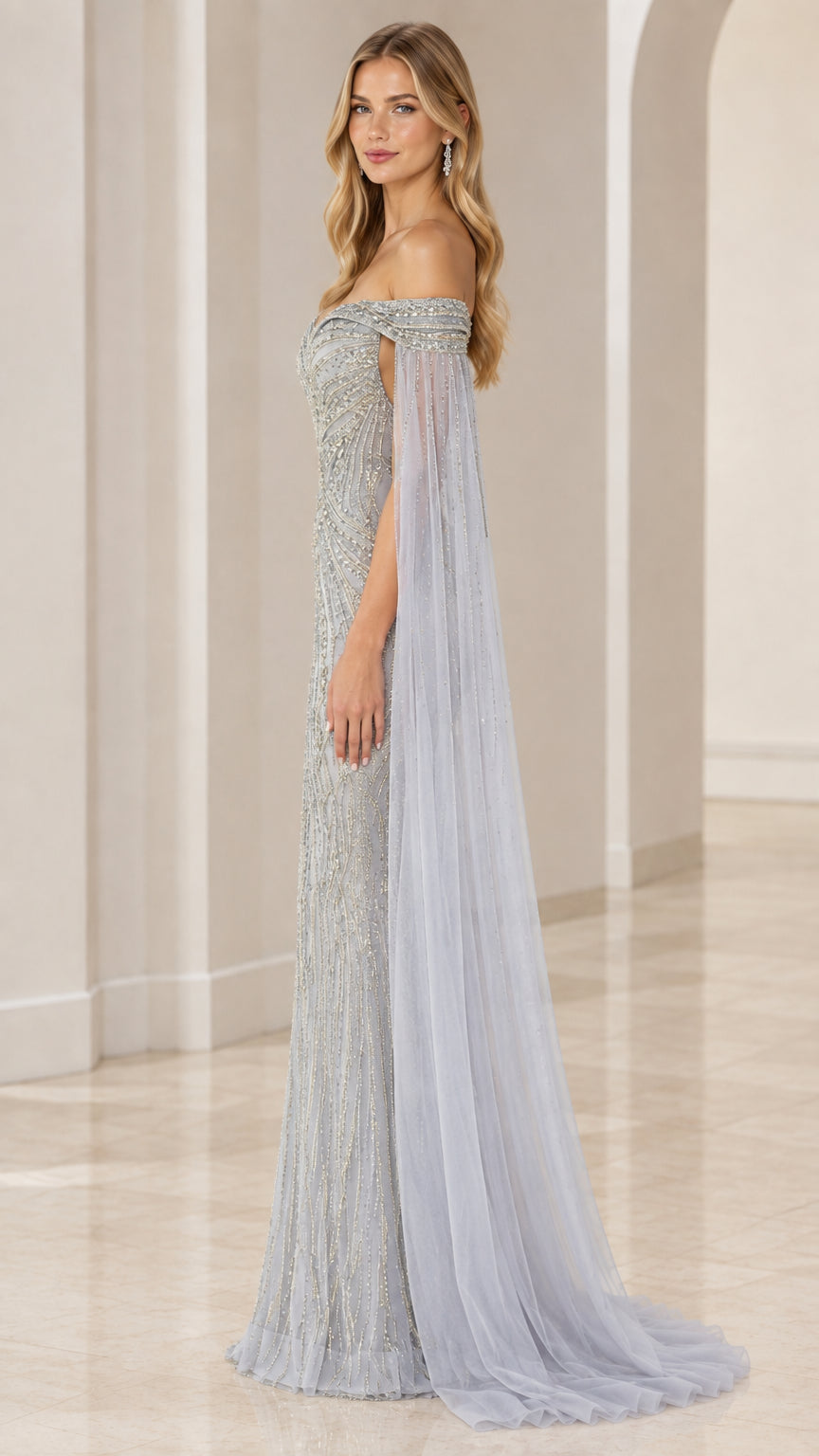 Side angle of model in a slate blue formal beaded gown showcasing cape drape