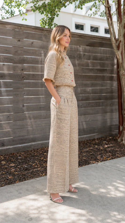 Side profile view of beige tweed outfit