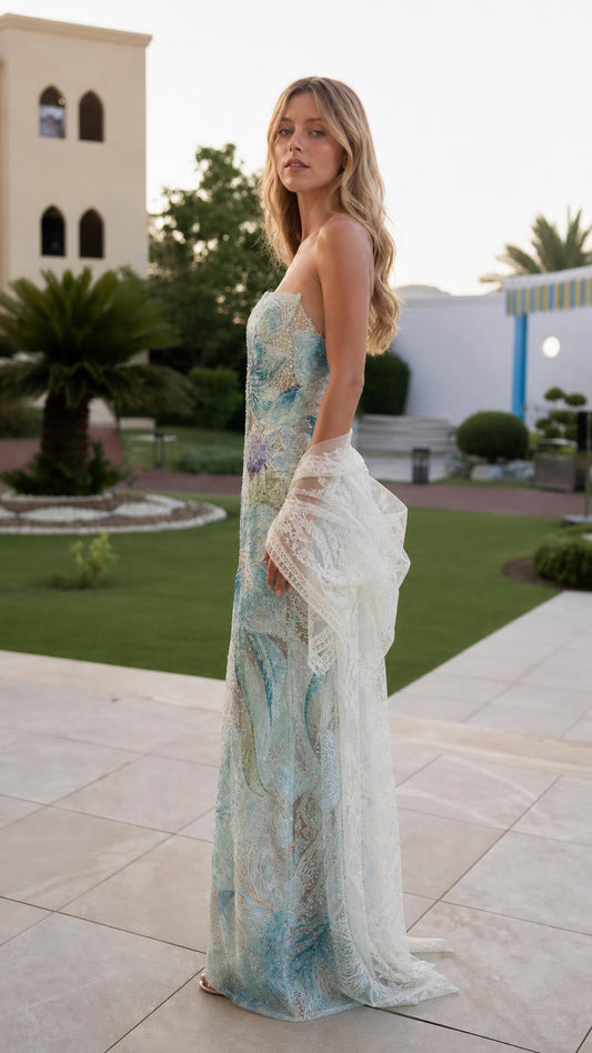 Side profile view of light blue embroidered dress