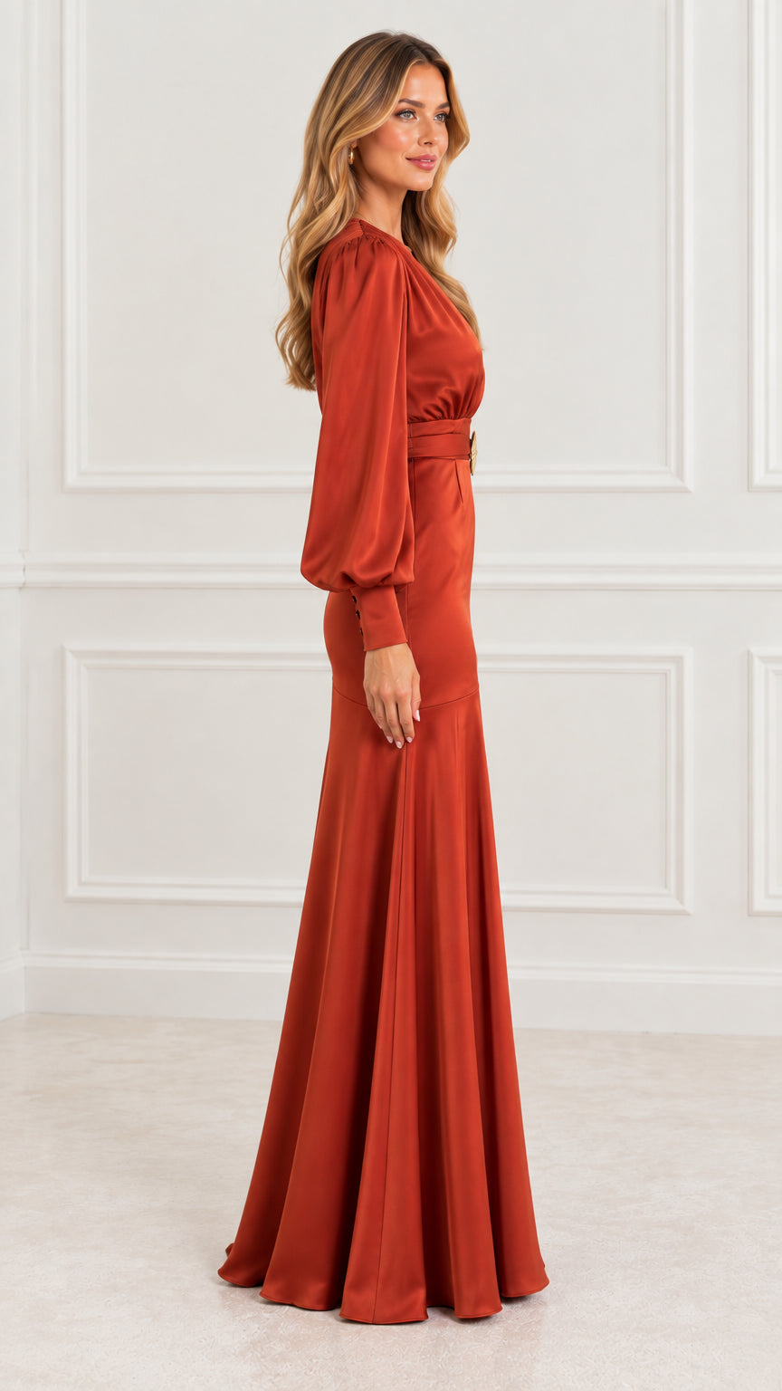 Side profile of model in rust orange satin floor-length evening dress