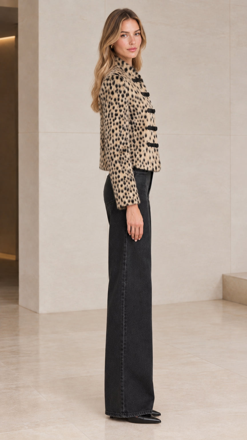 Side profile of model in Beige Leopard cropped jacket showing structured fit and sleeve detail