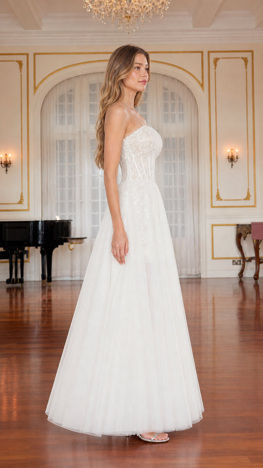 Side profile view of white strapless lace corset evening gown