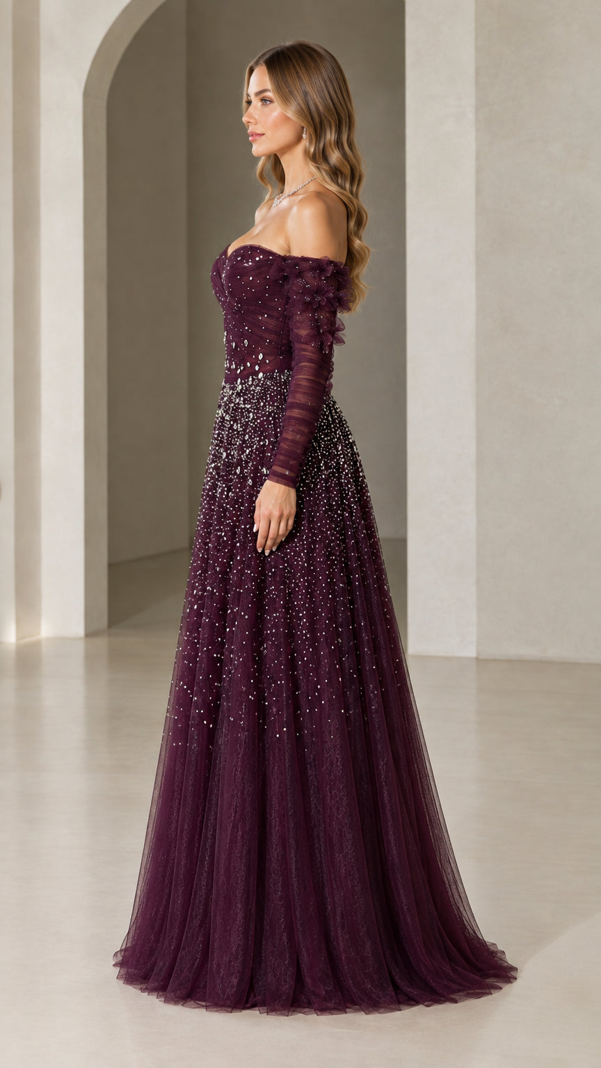Side view of woman wearing plum beaded tulle formal gown with floral sleeves