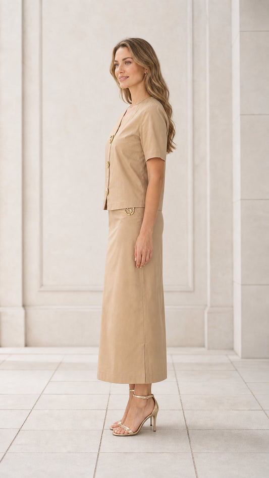 Side profile view of woman wearing khaki tailored two-piece maxi skirt set