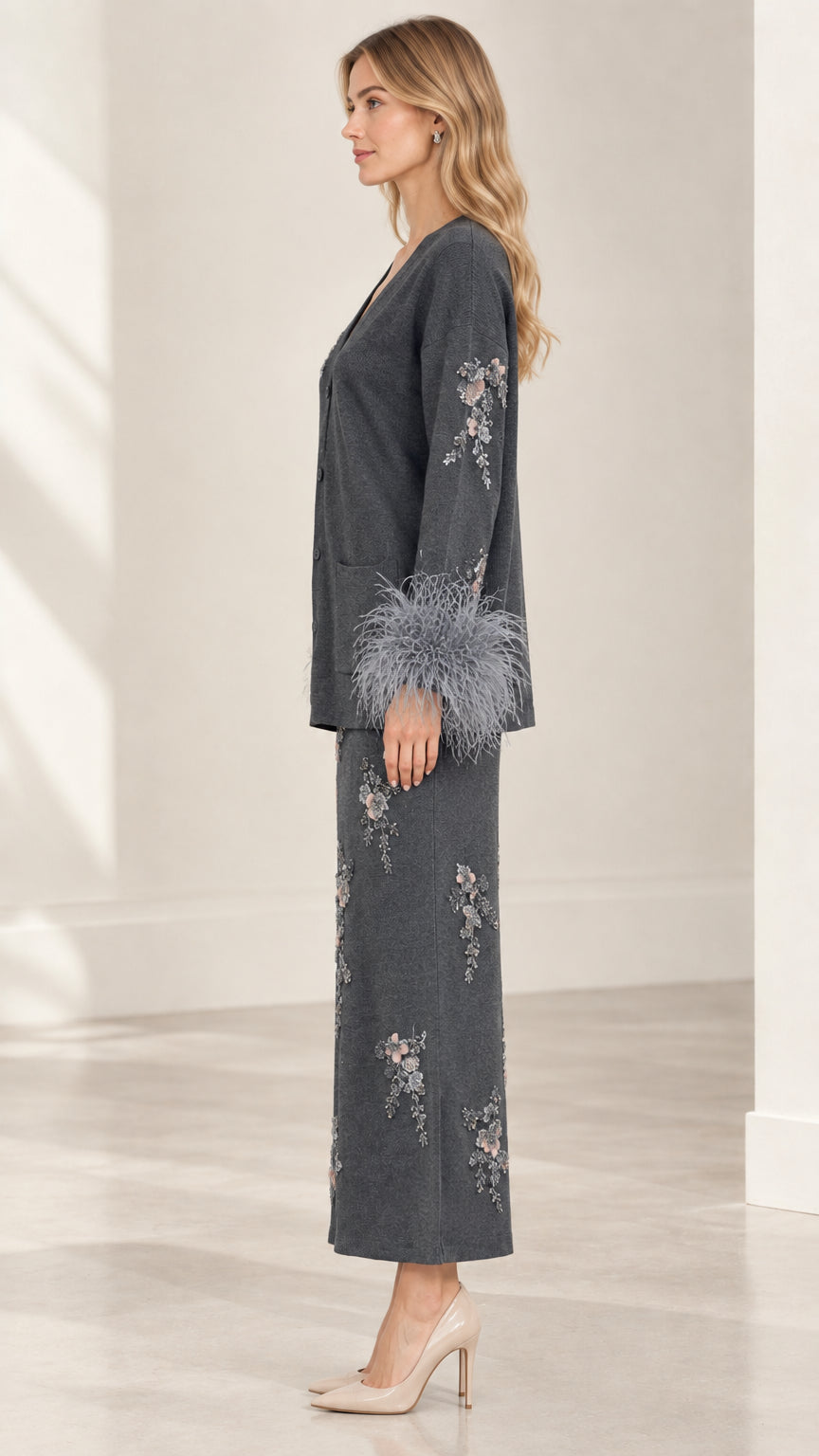 Side view of model wearing Charcoal Grey knit cardigan and column skirt set