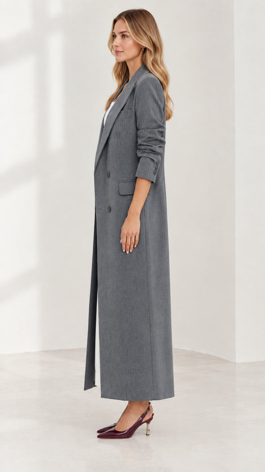 Side profile view of woman modeling longline grey double-breasted duster coat