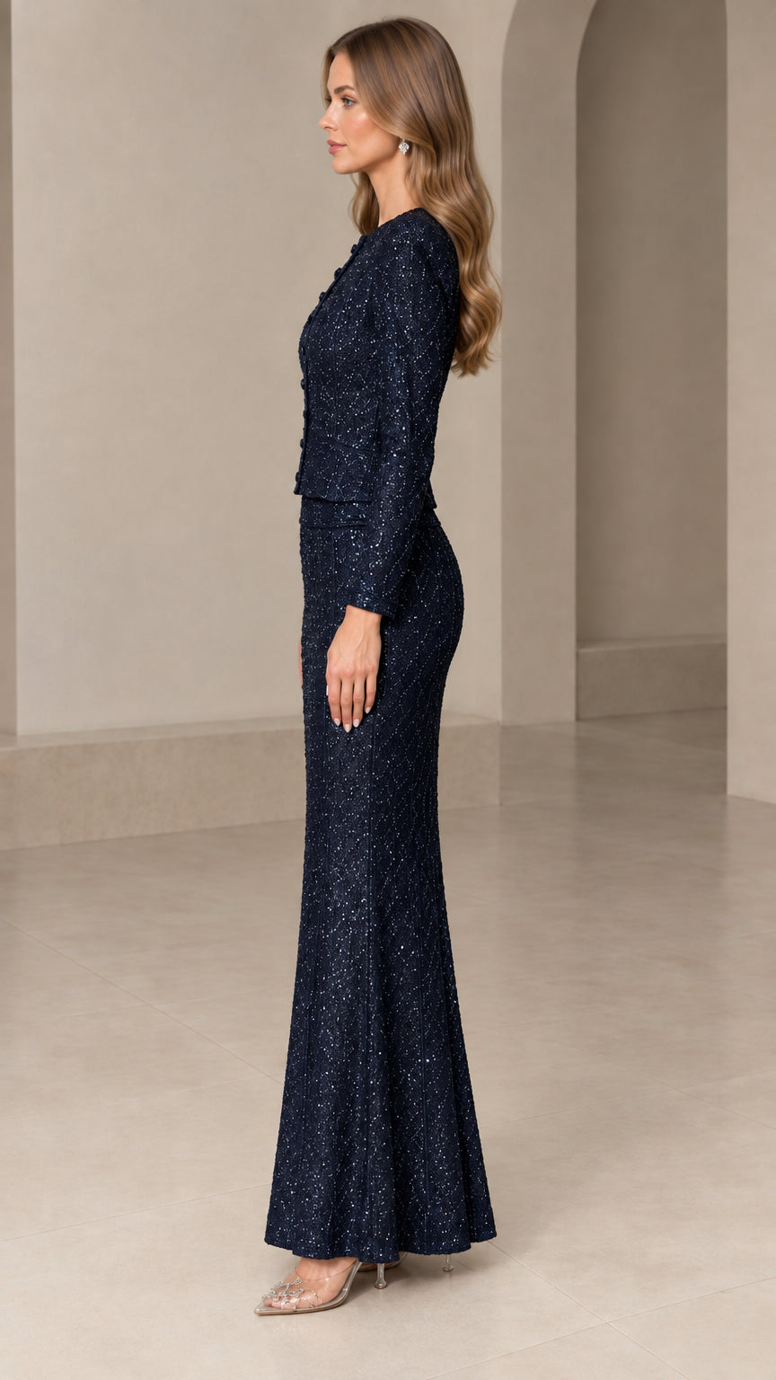 Side profile of model wearing Navy Blue sparkling two-piece formal gown set