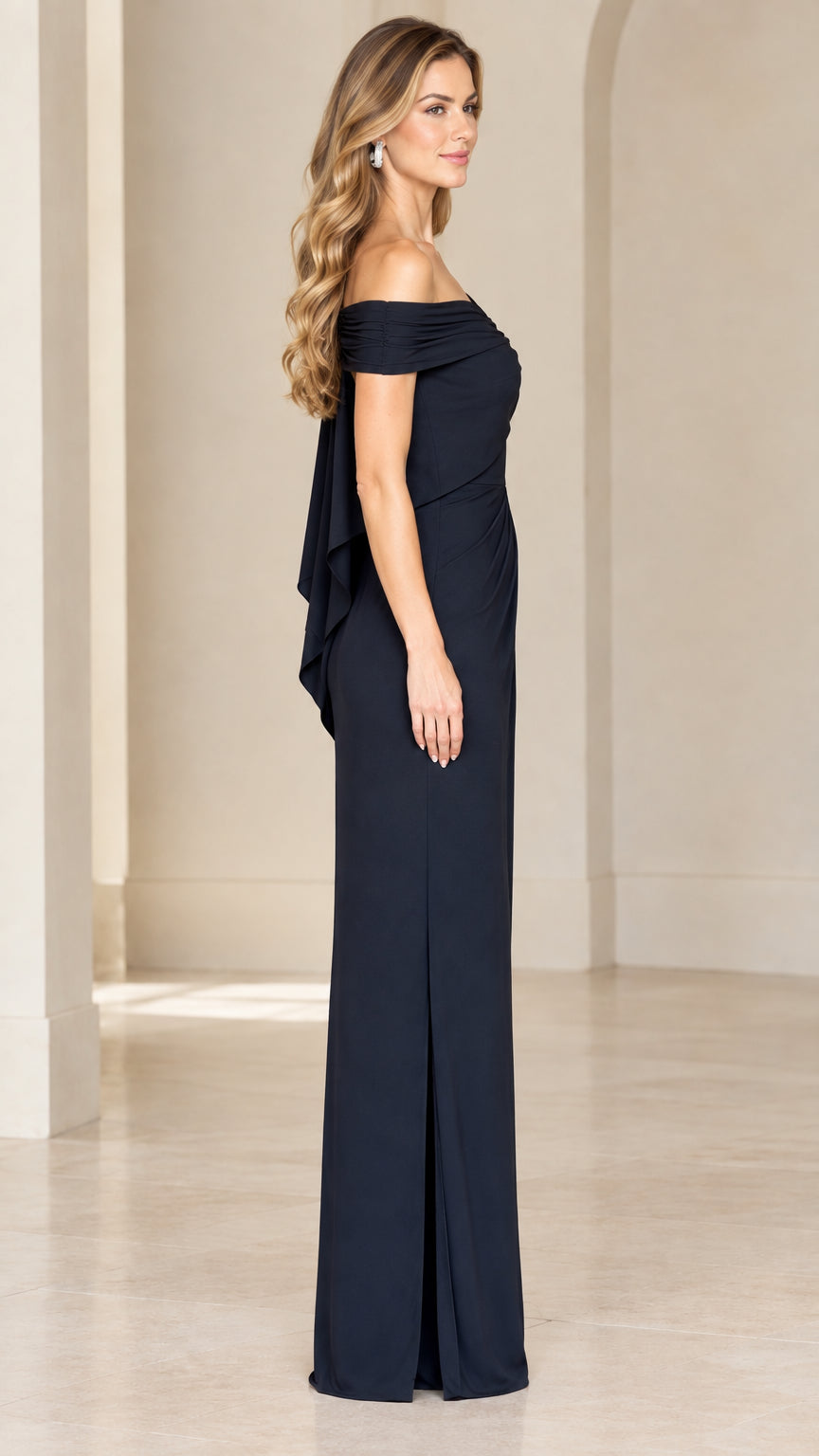 Side view of woman in navy blue floor-length evening dress showing side slit