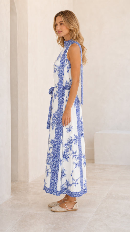 Side profile view of white floral maxi dress with waist tie