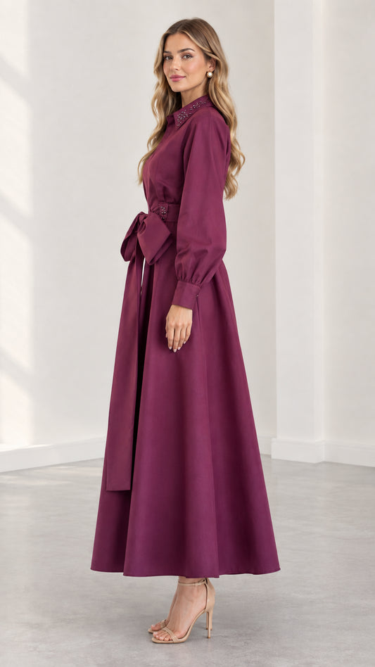 Side profile view of plum A-line long sleeve maxi dress