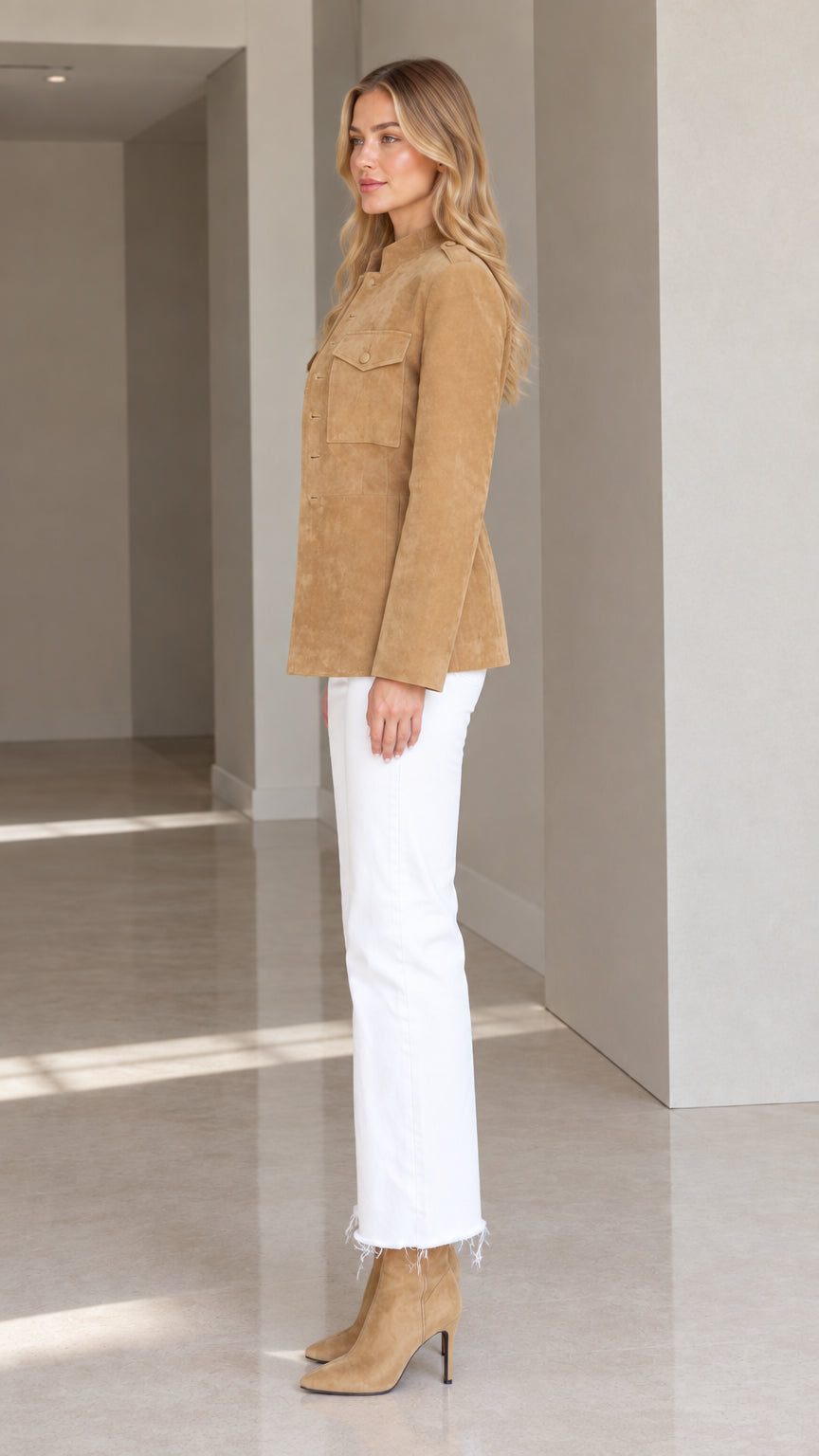Side profile view of woman wearing Camel button-front suede jacket