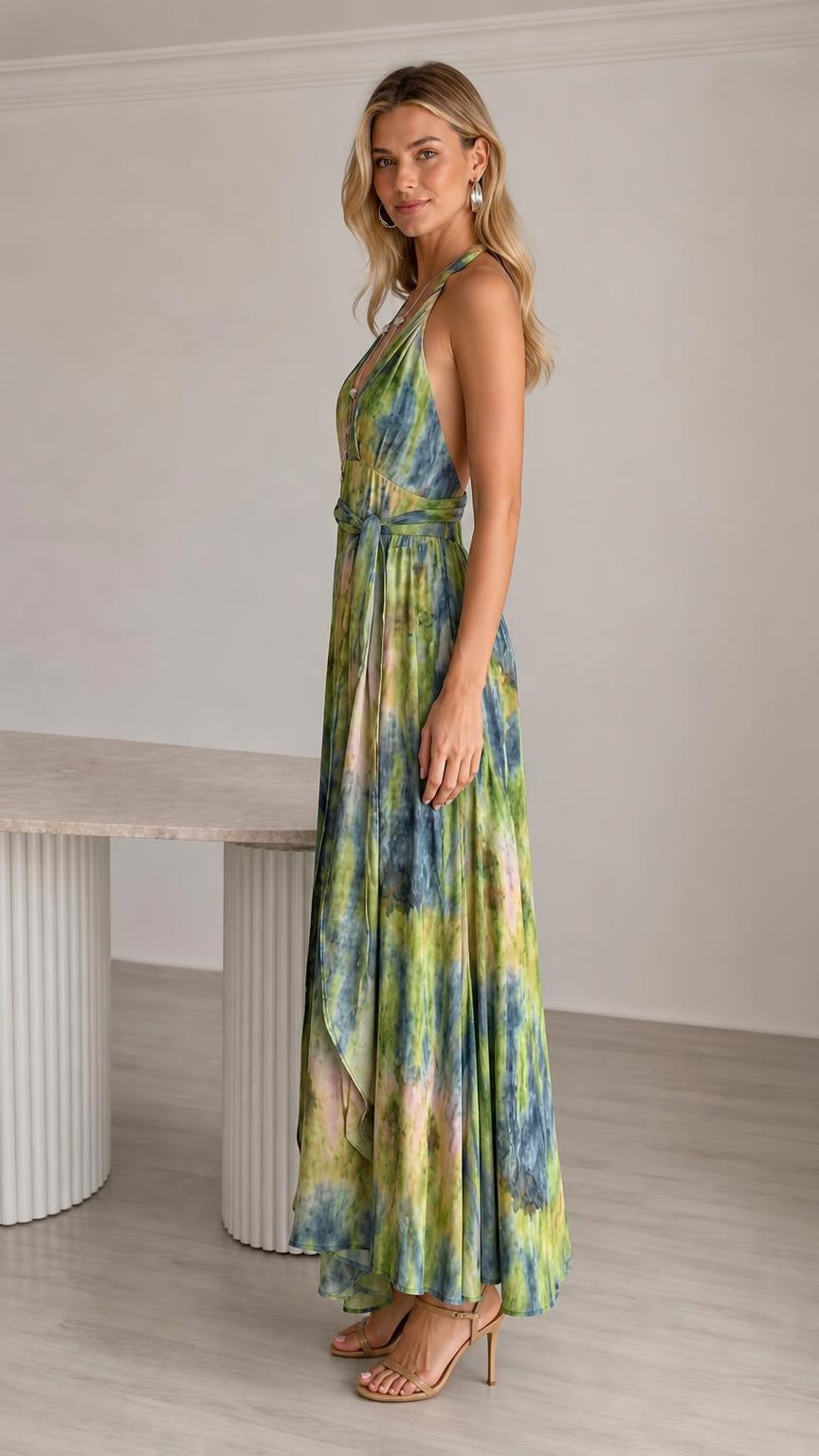 Side profile view of green tie-dye halter jumpsuit