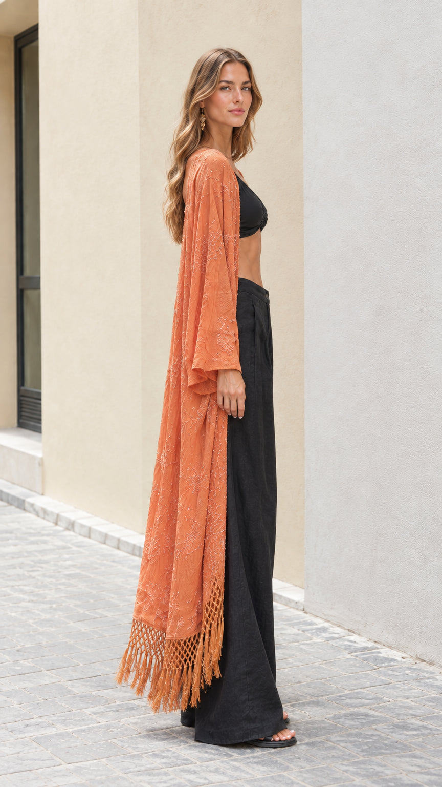 Side profile view of rust orange embroidered open front duster kimono