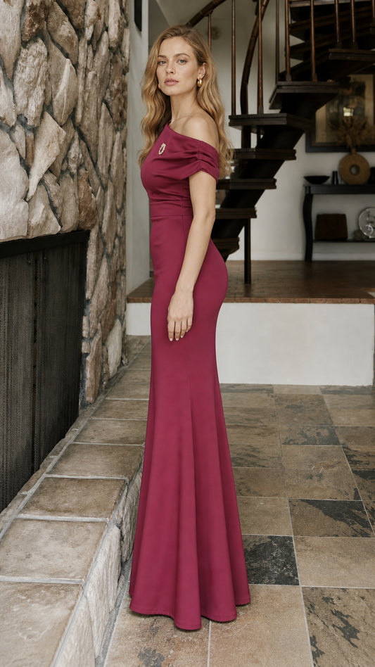 Side profile view of burgundy formal evening gown