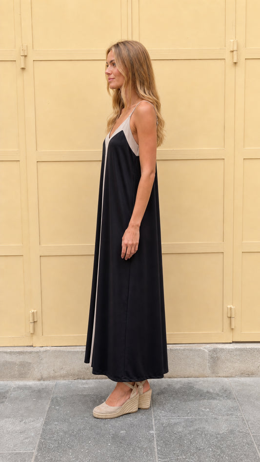 Side profile view of black contrast maxi dress