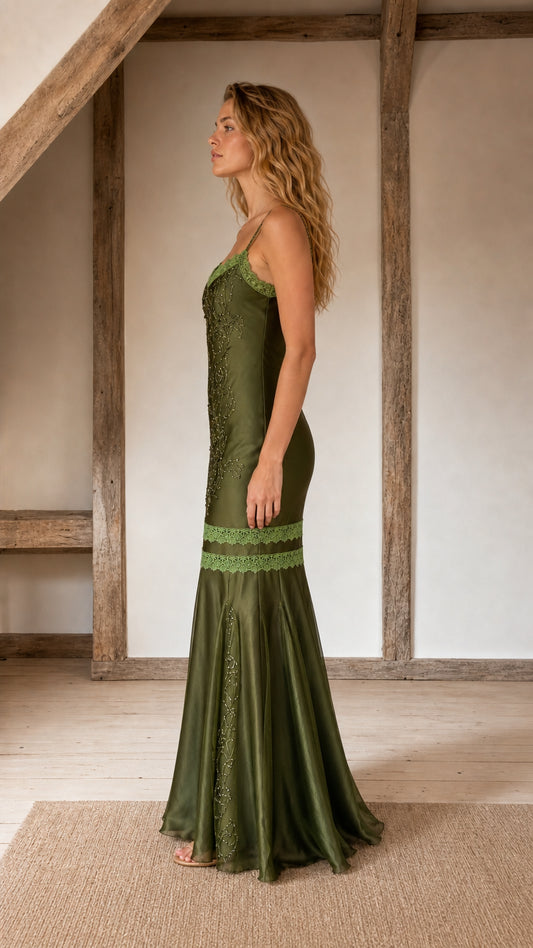 Side profile view of olive satin evening gown