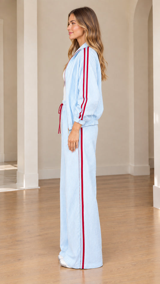Side profile view of light blue striped two-piece lounge set showing red side racing stripe