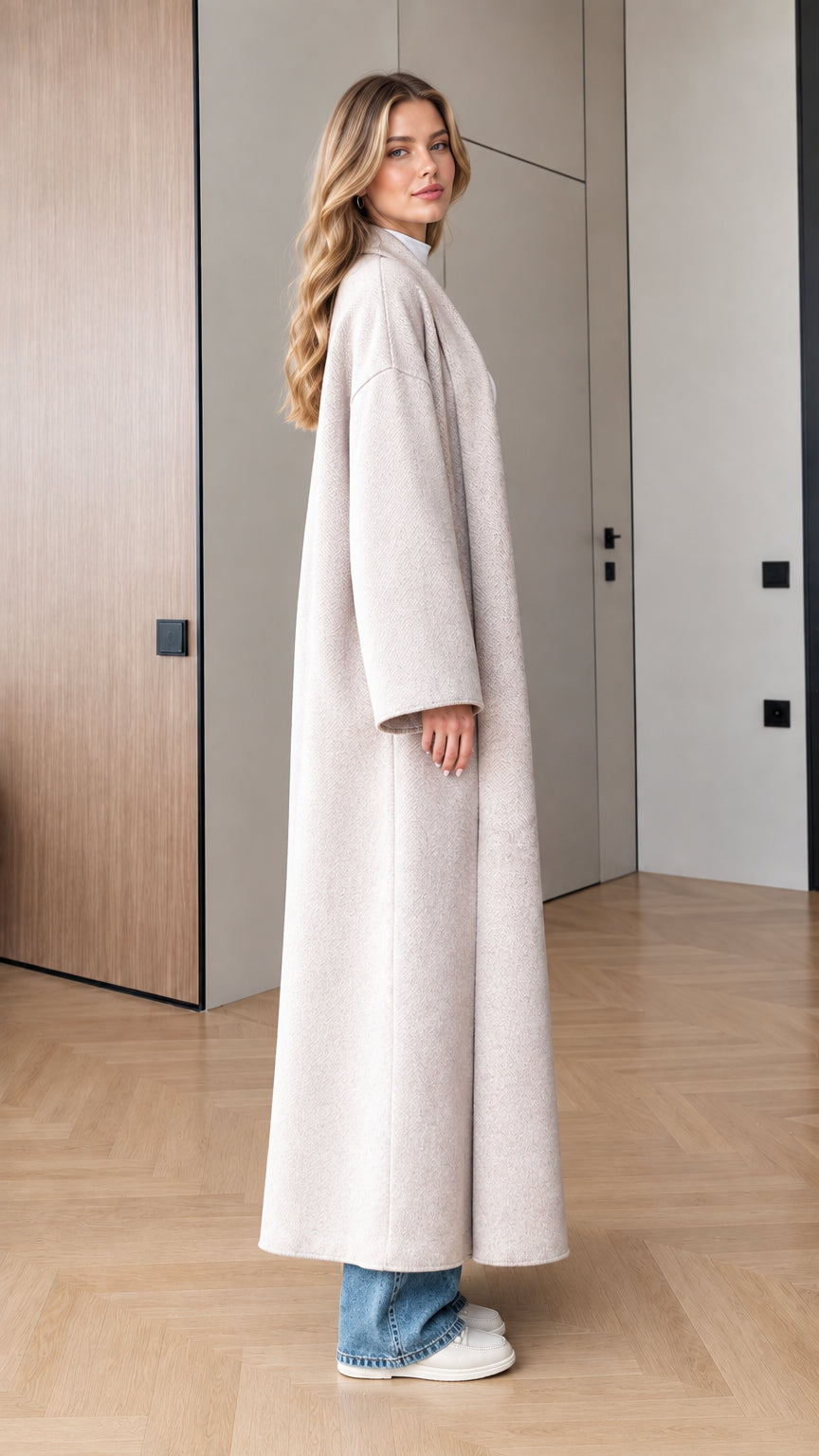 Side profile view of model wearing Oatmeal oversized maxi coat