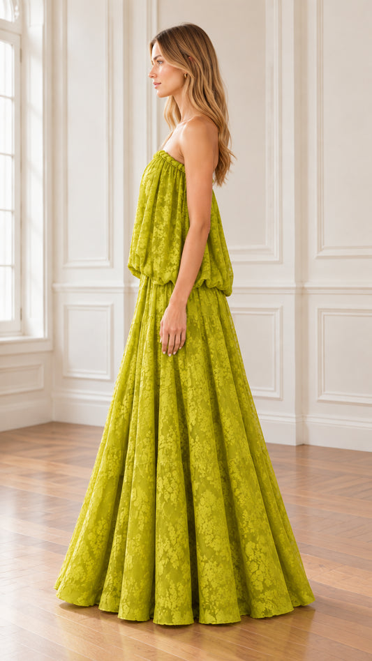 Side profile view of model wearing Chartreuse Green strapless blouson maxi gown