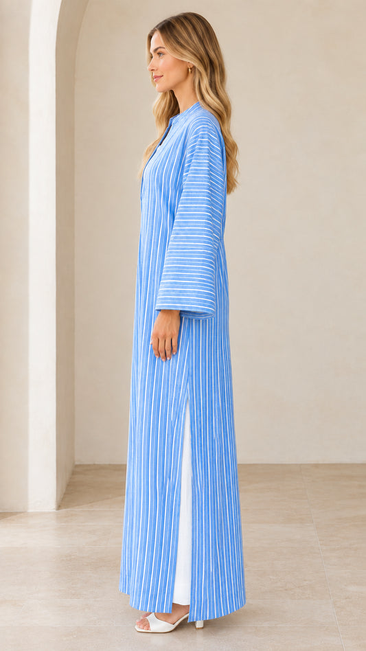 Side profile of woman wearing sky blue striped longline dress