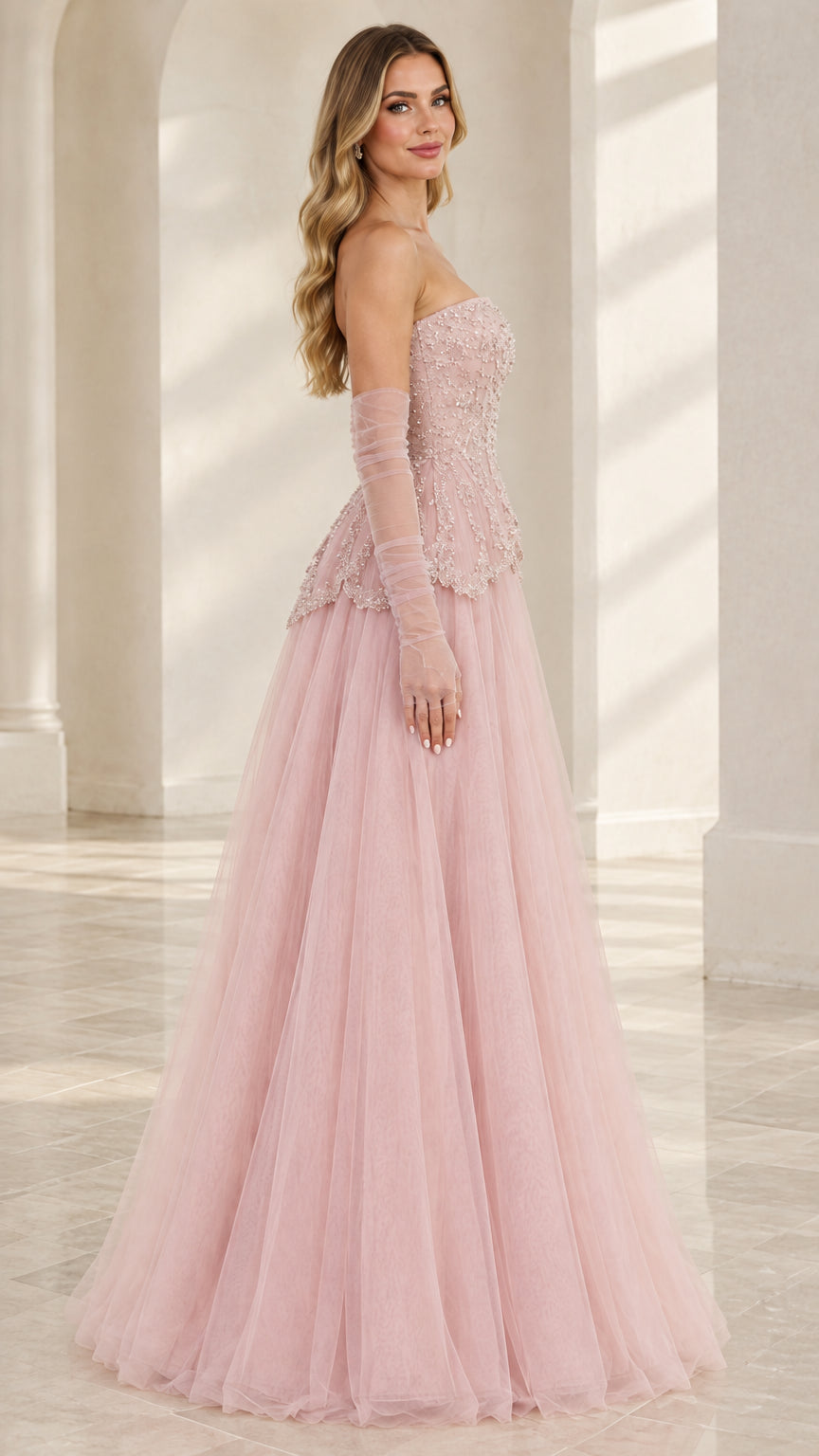 Side view of Blush Pink strapless evening gown showing floor-length tulle skirt