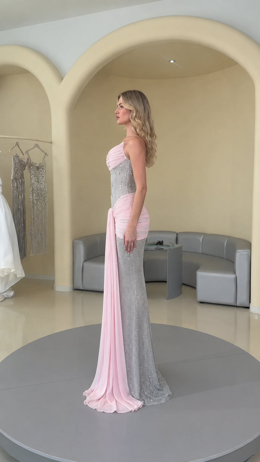 Side profile view of pink and silver embellished formal maxi dress