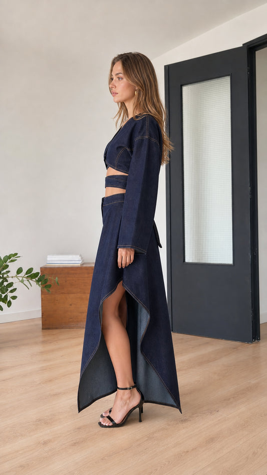 Model wearing indigo blue set, side view highlighting skirt slit