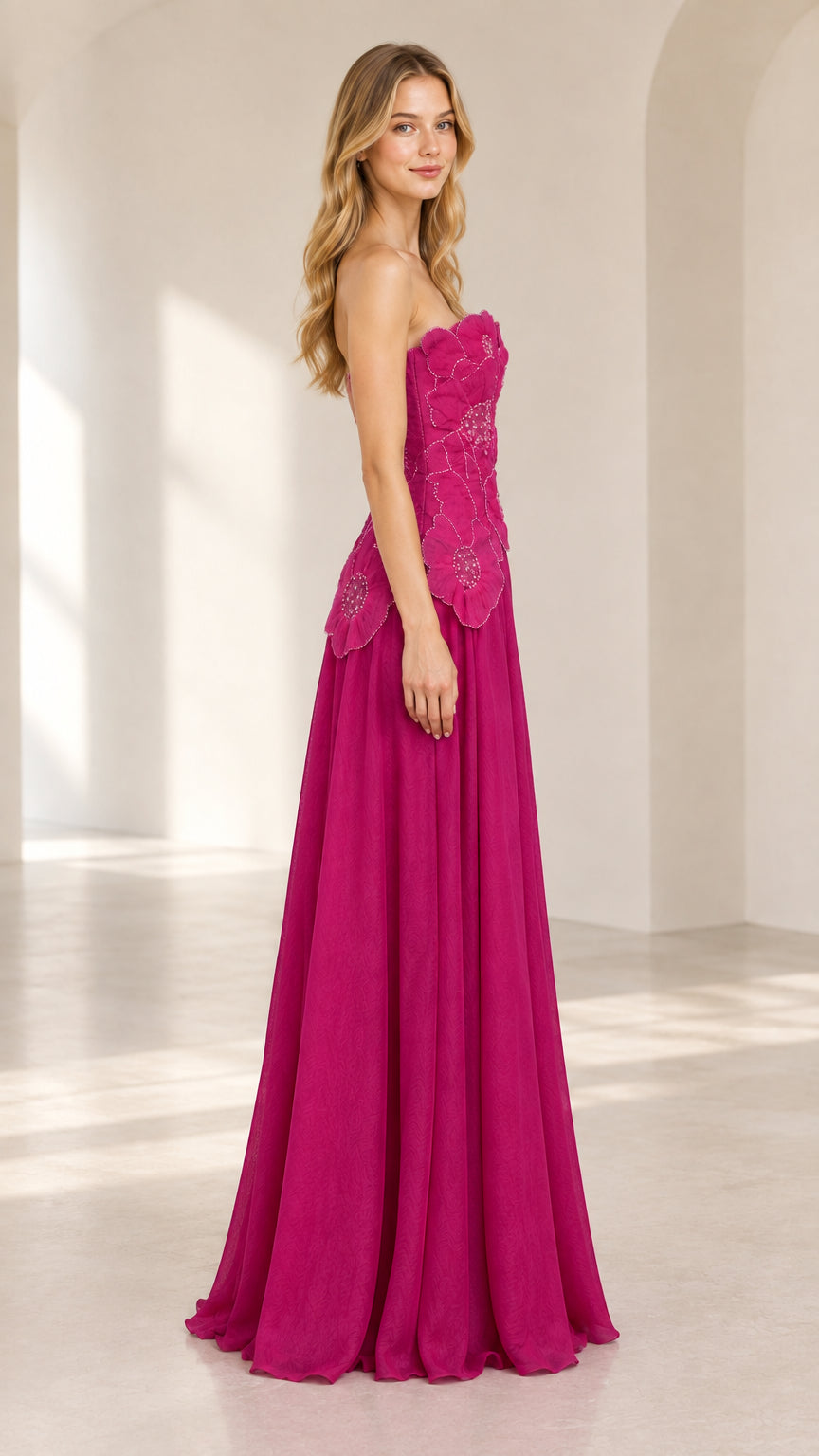 Side profile view of model wearing magenta strapless floral formal dress