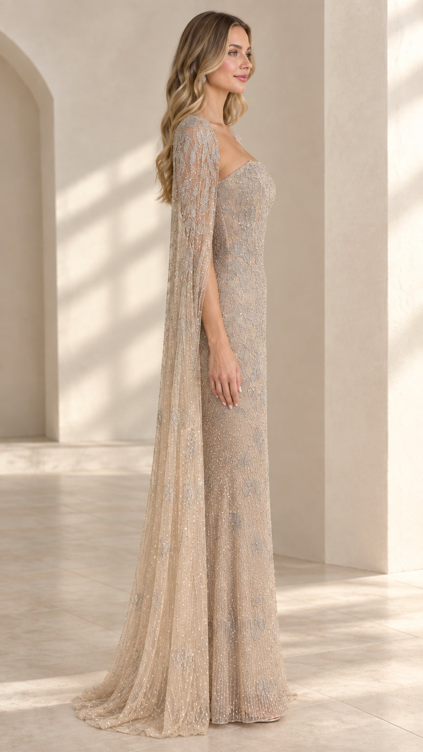 Side angle of model in champagne sequined formal gown showcasing cape drape