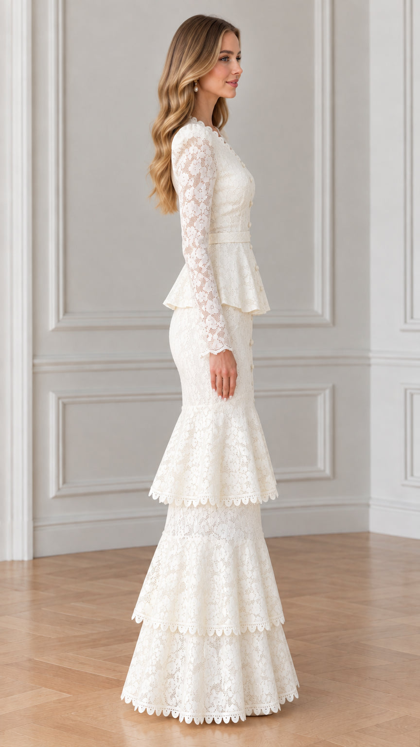 Side profile of woman in white belted lace maxi dress with tiered flared skirt