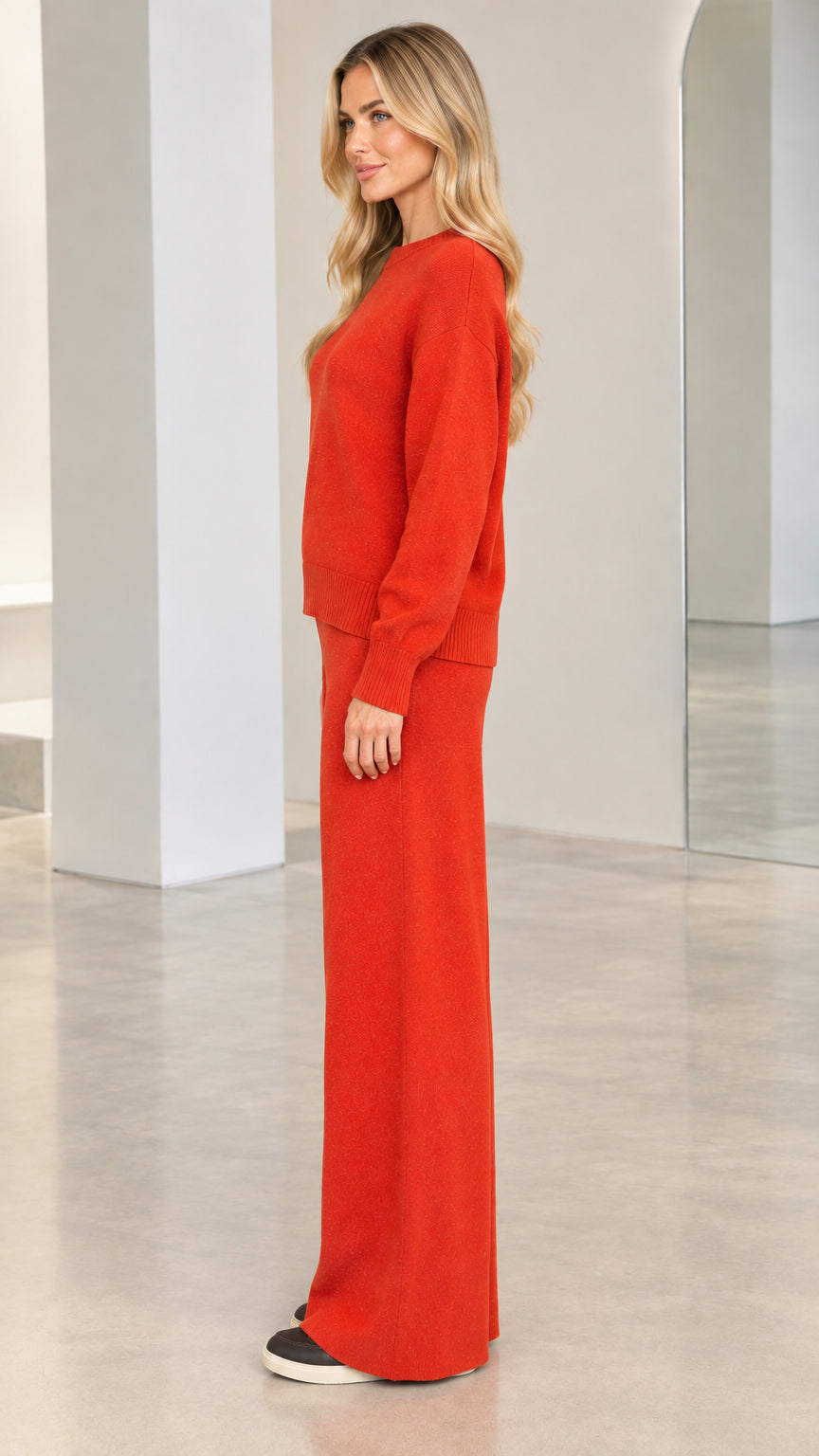 Side profile view of model in rust red two-piece knit lounge set