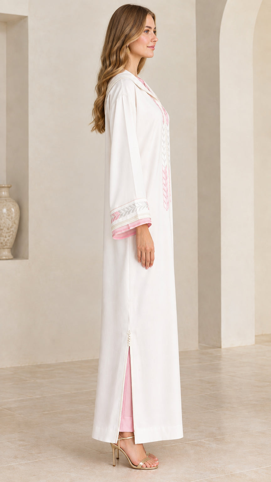 Side view of women's white hooded kaftan showing side slit and contrast trim