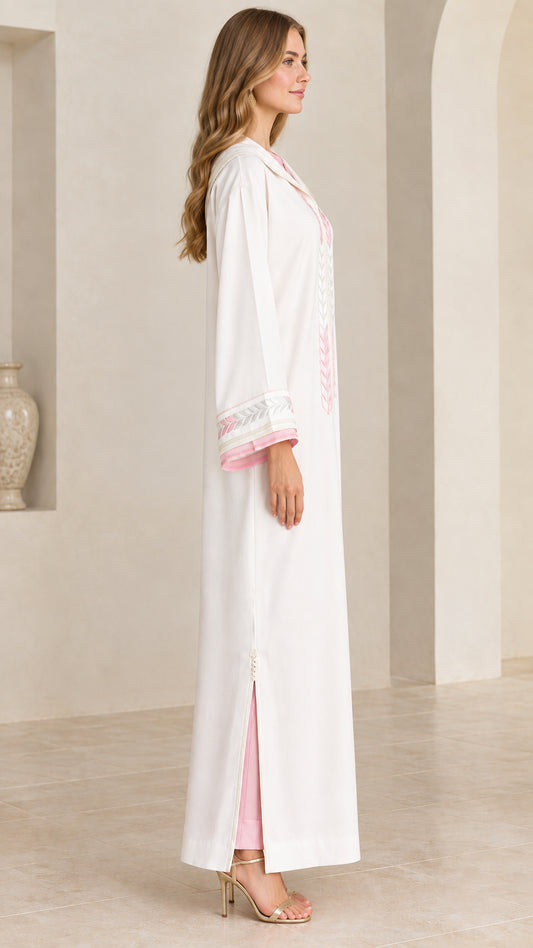 Side view of women's white hooded kaftan showing side slit and contrast trim