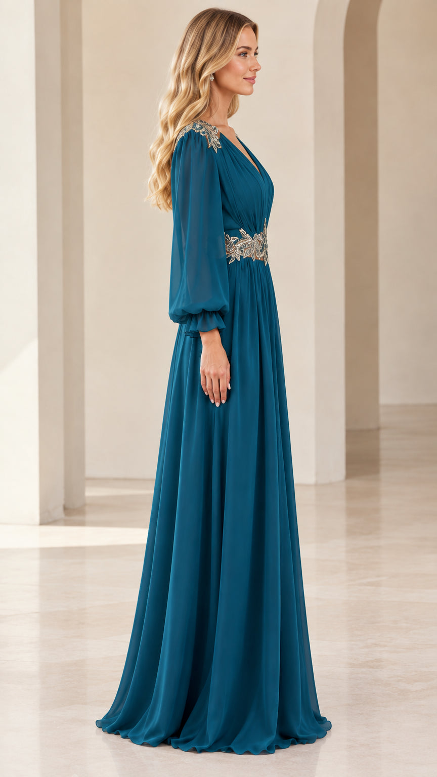 Side profile of woman in flowing teal blue formal maxi dress with sheer long sleeves