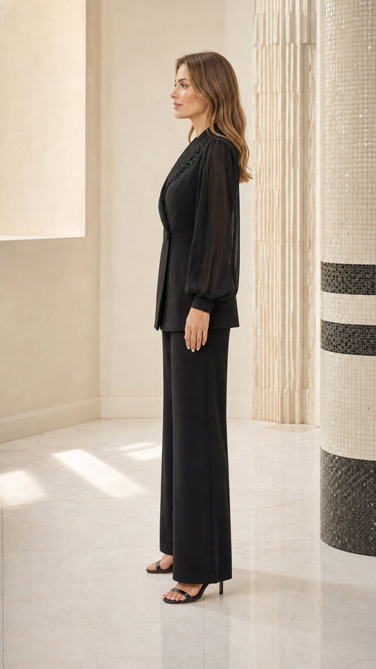 Side profile view of black pantsuit