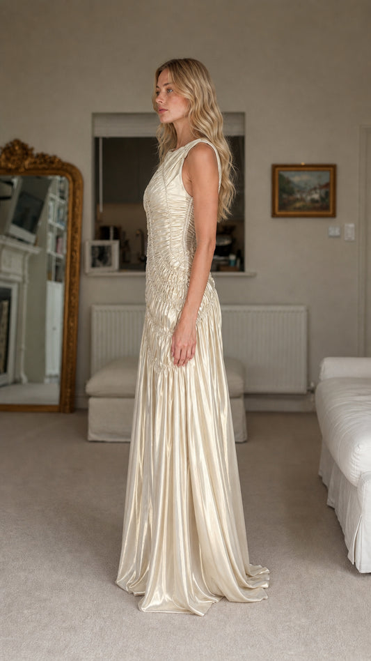 Side profile view of champagne evening dress