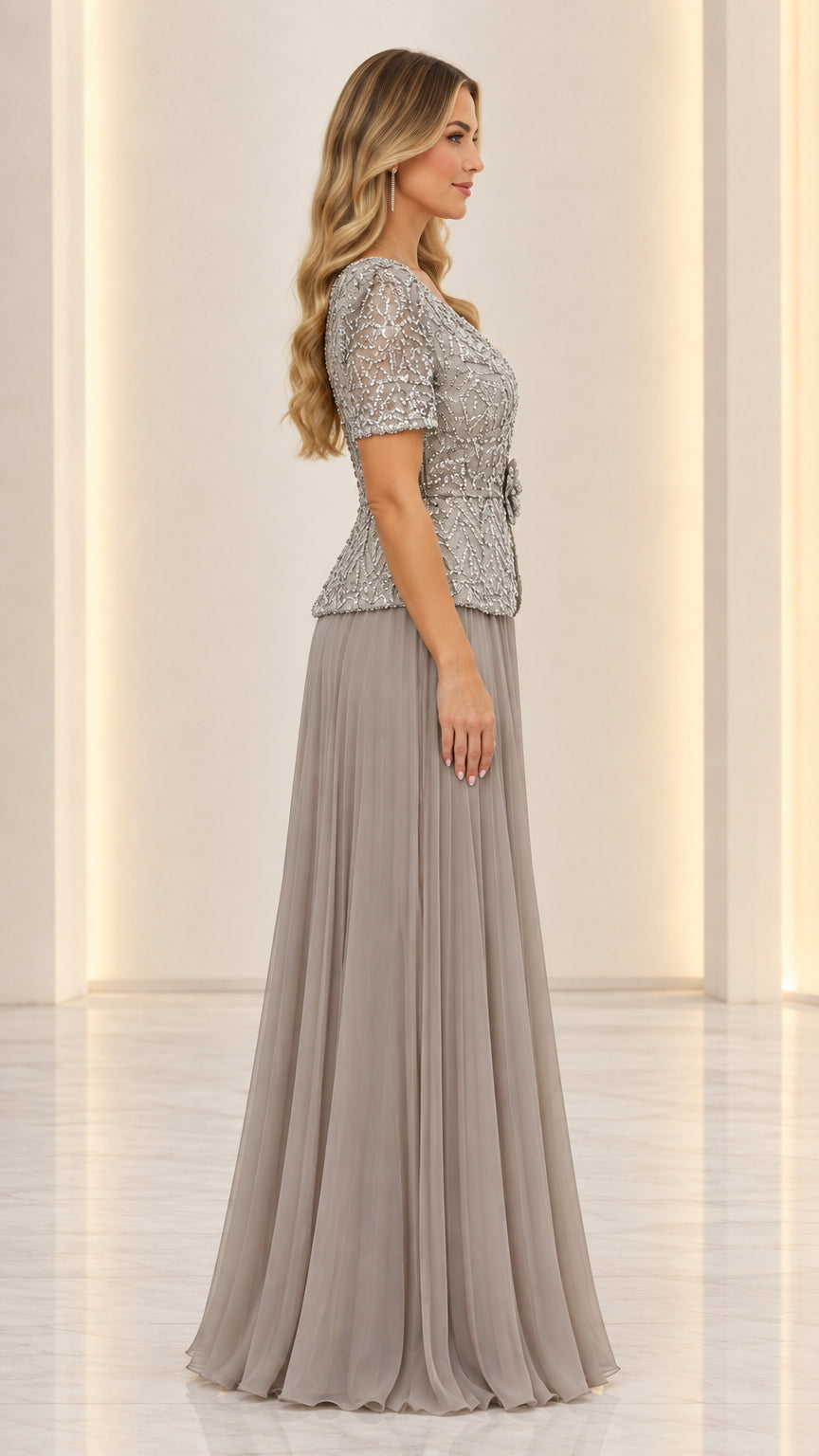 Side view of woman wearing slate grey short sleeve formal pleated gown