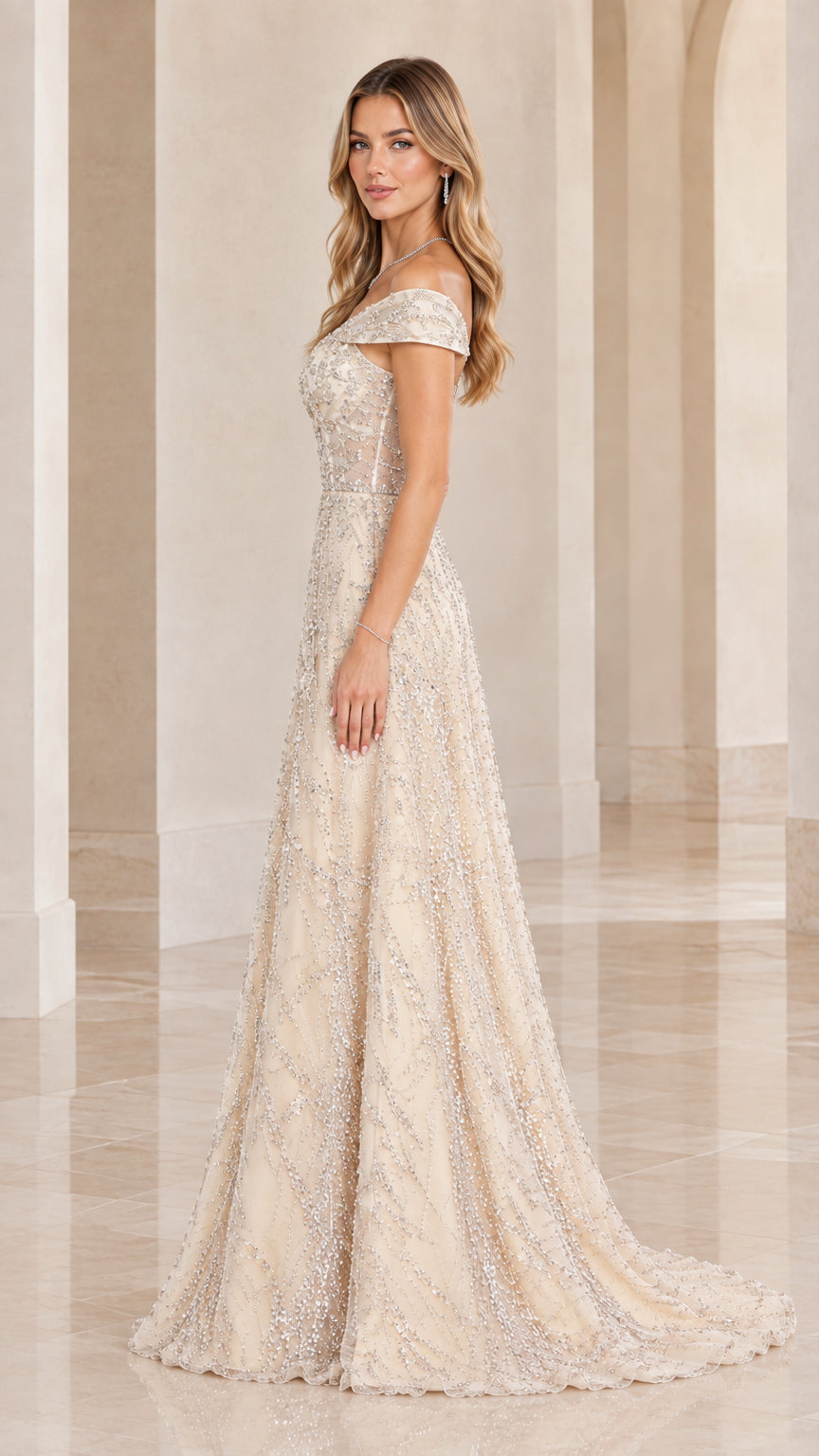 Side angle view of woman modeling Champagne beaded tulle formal dress
