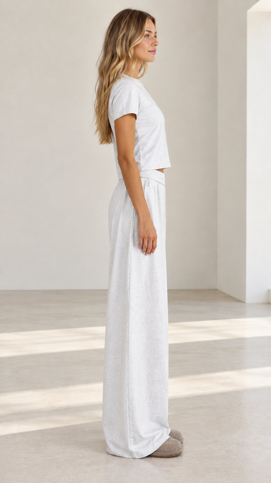Side profile view of model wearing light grey matching two-piece loungewear set