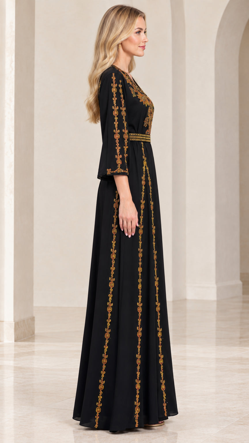 Side profile of woman wearing black embroidered maxi dress