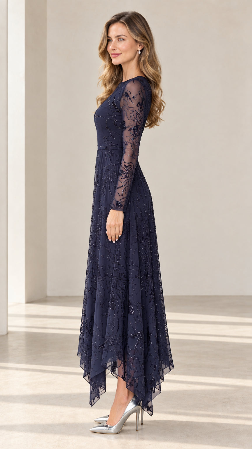 Side profile of navy blue long sleeve sequin formal dress with asymmetrical handkerchief hem