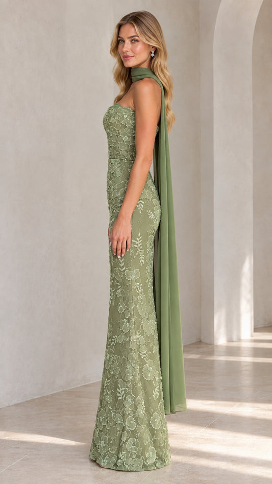 Side view of sage green embroidered column gown showing trailing chiffon scarf